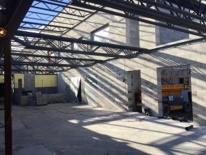 Steel is being laid in place for the second floor hallway that will connect the Teen Center to the Learning Center. In the center of this photo is the location of the former kitchen.