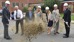 The ceremonial first shovelful of dirt flies towards the camera to mark the groundbreaking of the new McKeown Boys & Girls Club project. (l-r) Tucker Donaghey, Bill Cimmings, Mnatt Maggiore, Denise McKeon, Julie Gage, Mayor Galvin and Century Bank represetative Brad Buckley. Mr Cummings reported that this was his first time actually tossing a shovelful of dirt in 40 years of building openings! Photo by JoeBrownPhotos.com
